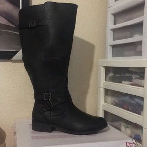 Women’s extended calf black boots.